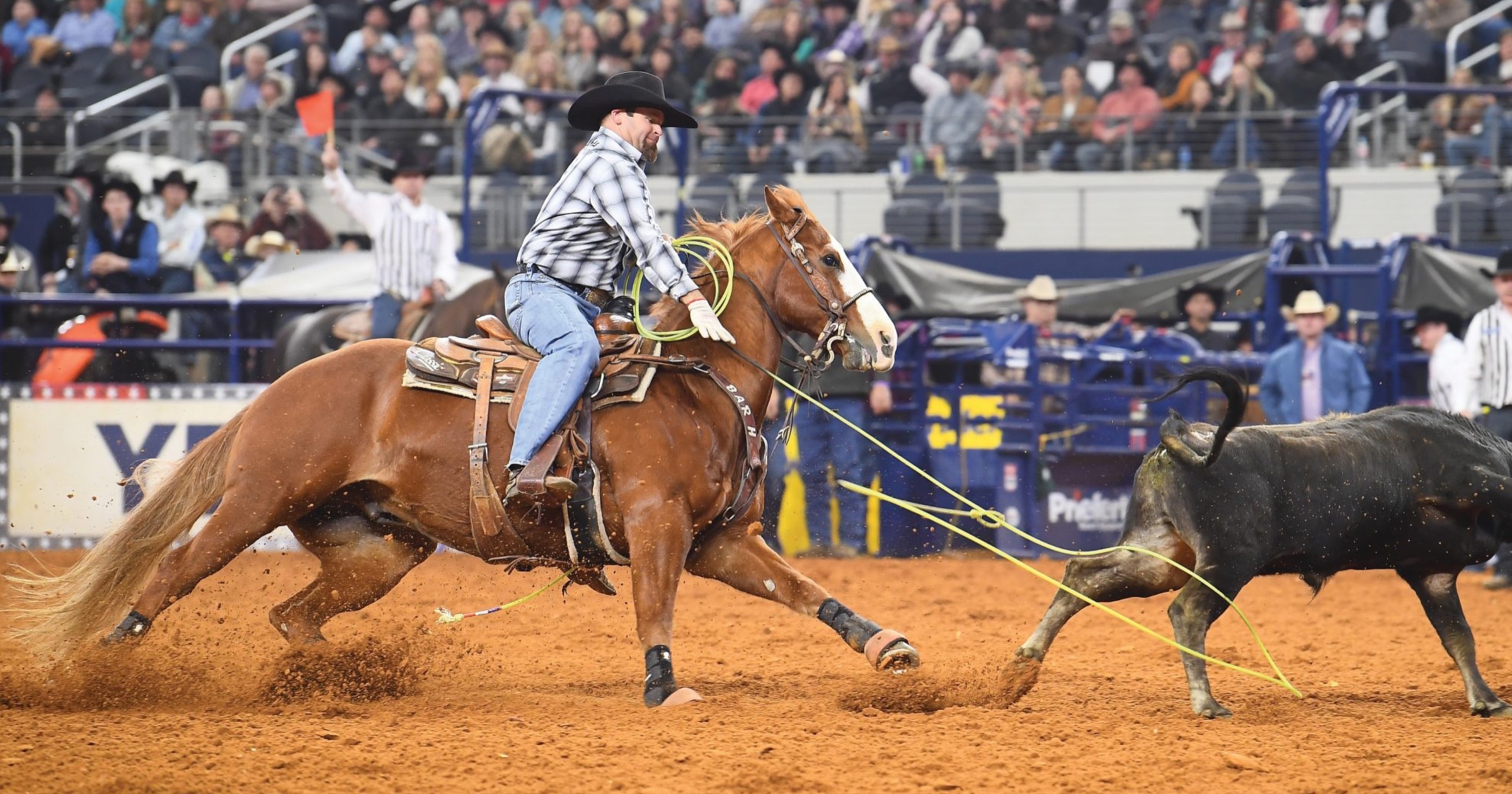 Ryan Motes heeling a steer on his rope horse at The American